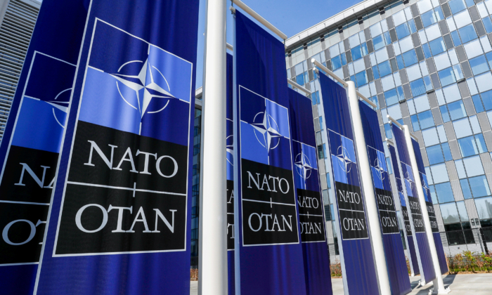 id5396973 Banners displaying the NATO logo are placed at the entrance of new NATO headquarters 700x420 vryOgE