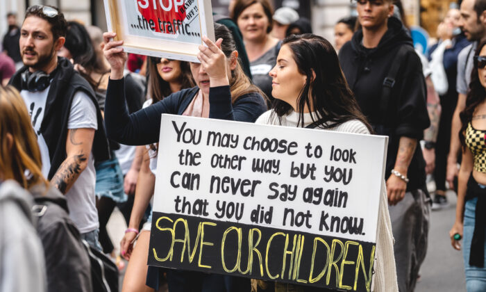 People with banners and placards shouting at Save Our Children Protest against Children Trafficking 700x420 6wprPS